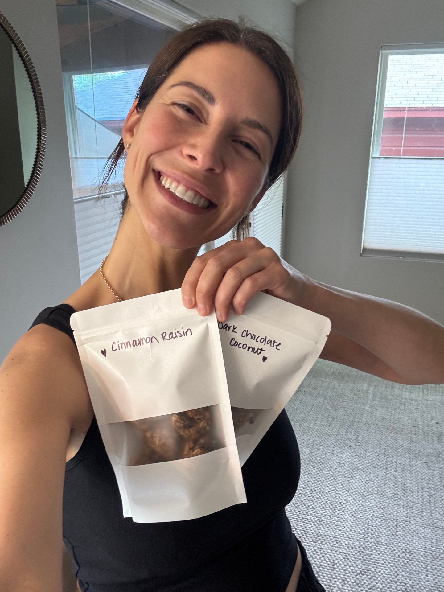 Emily holding early hand-labeled Mama Bites pouches